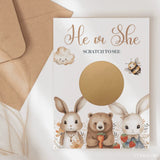 Gender reveal card with cartoon animals and a gold scratch-off panel.