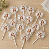 White lollipops with 8cm sticker featuring a girl with flower crown and hands folded for karens confirmation day
