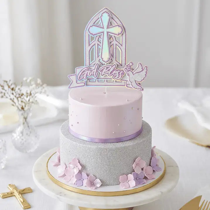 A two-tiered cake with a smooth lavender top tier and a glittery silver bottom tier, adorned with delicate pink and purple sugar flowers around the base.