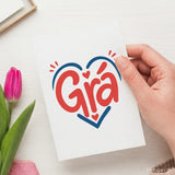 A white irish love card with the word grà in bold red script inside a blue heart with small hearts and rays