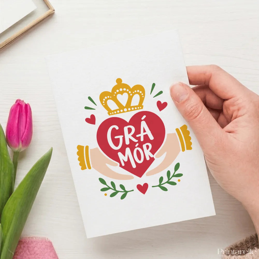 White greeting card with a vibrant red heart crowned in gold and Irish phrase grá mór perfect irish love card for great love