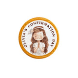Circular gold-edged 40mm milk chocolate confirmation chocolate coin with a praying girl illustration for olivias confirmation day