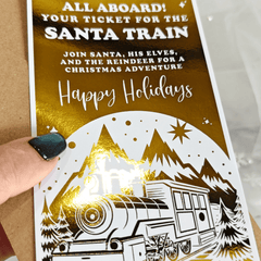 Invitation card for Santa Train Christmas adventure with gold and white design.