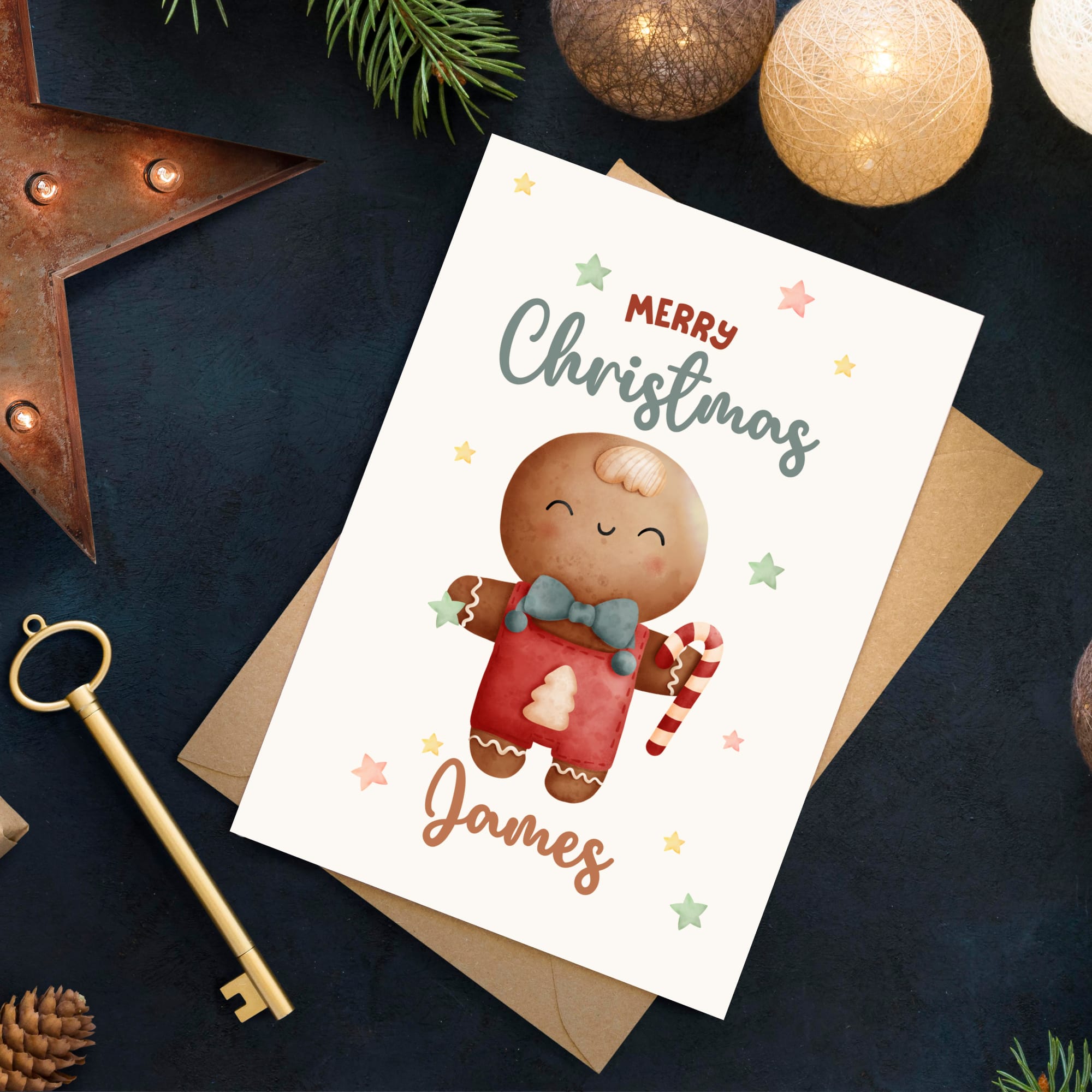 Christmas card with a gingerbread man design on a dark surface with festive decorations.