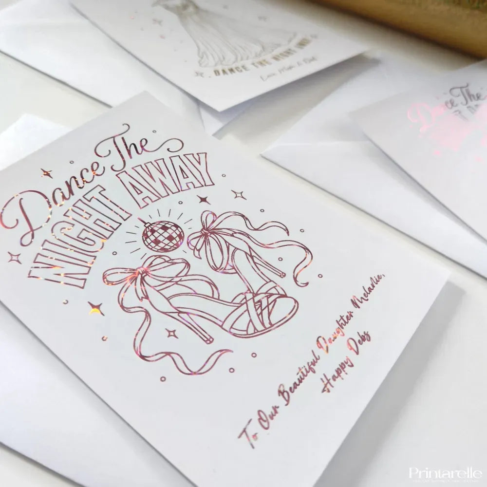 A white graduation card with rose gold foil dancing shoes design and rainbow glitter foil text for daughter melanie