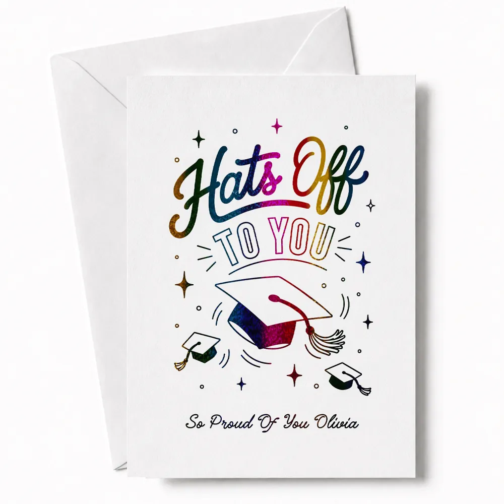 White graduation card with rainbow glitter foil lettering hats off to you and colorful mortarboard design