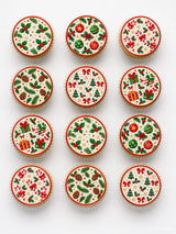 Holly and baubles cupcake toppers with festive red green and gold Christmas patterns on edible icing sheet