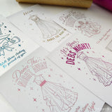 White paper debs night card with pink and gold foil dresses and party designs for navy suit and stars theme