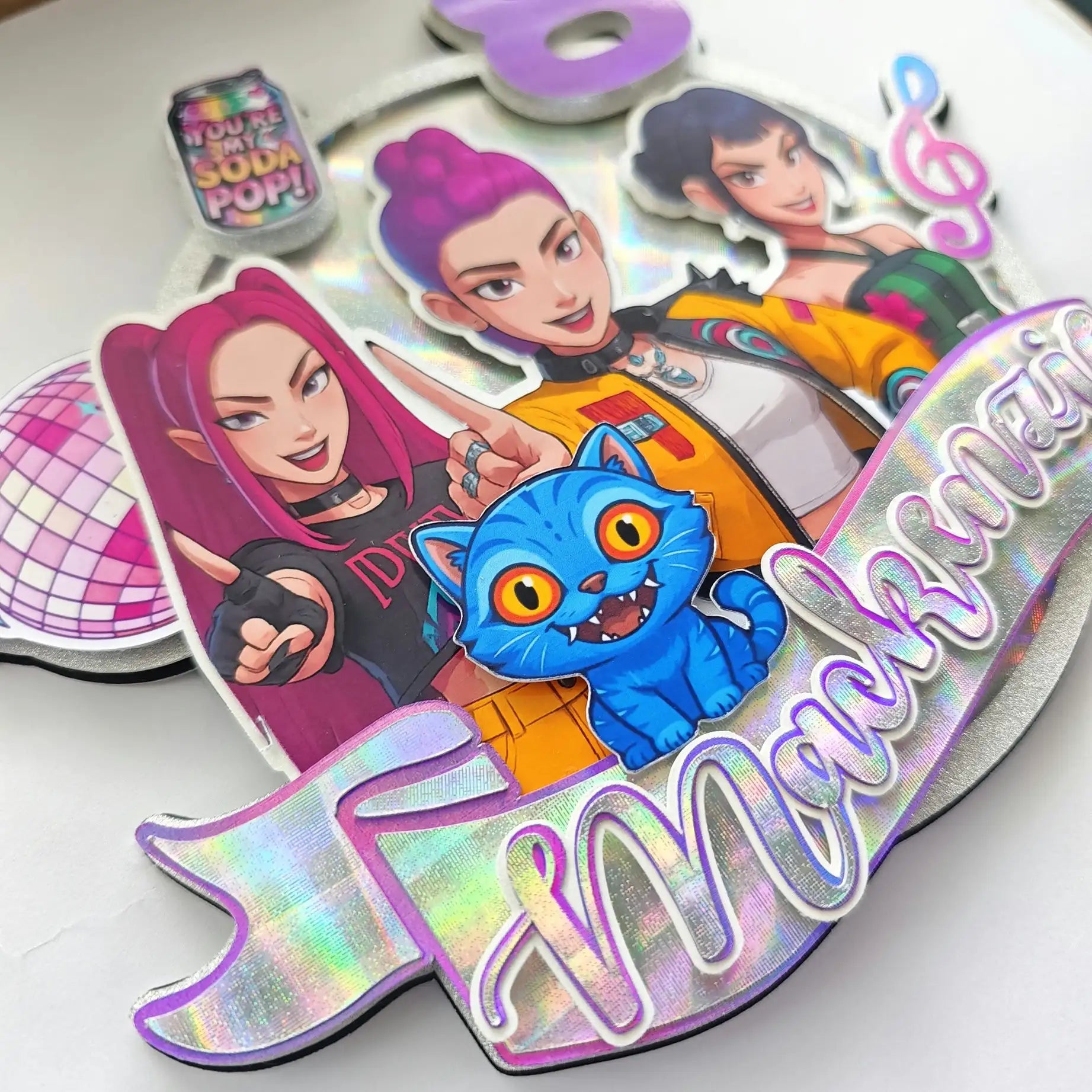 Holographic stickers with animated characters and text on a white background