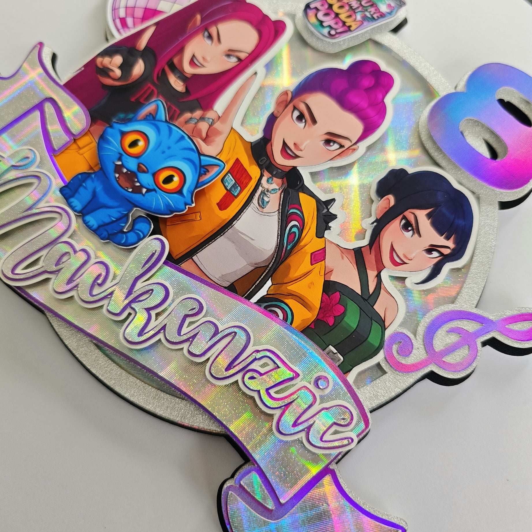 Colorful birthday card with animated characters and 'Happy Birthday' text.