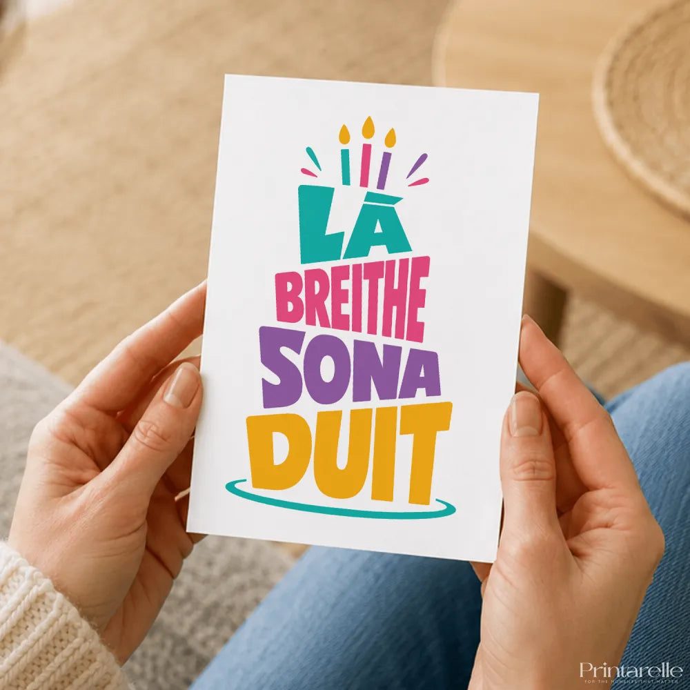 Colorful breithe sona duit birthday card with bold playful typography and cartoon cake illustration