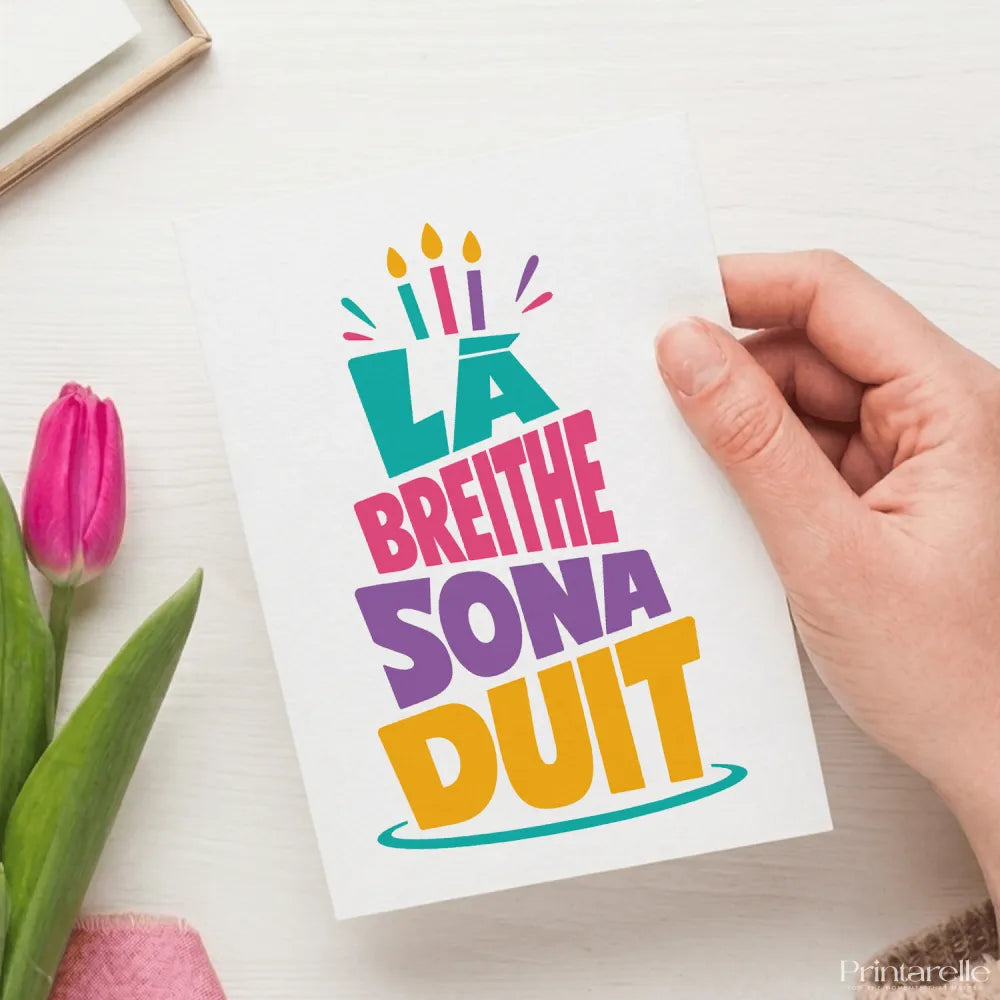 A vibrant multicolored breithe sona duit birthday card with bold lettering and illustrated candles perfect for celebrations
