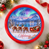 Red circular cookie tin with festive lapland reindeer sleigh tub sticker and northern lights over frozen lake design personalized with melanie
