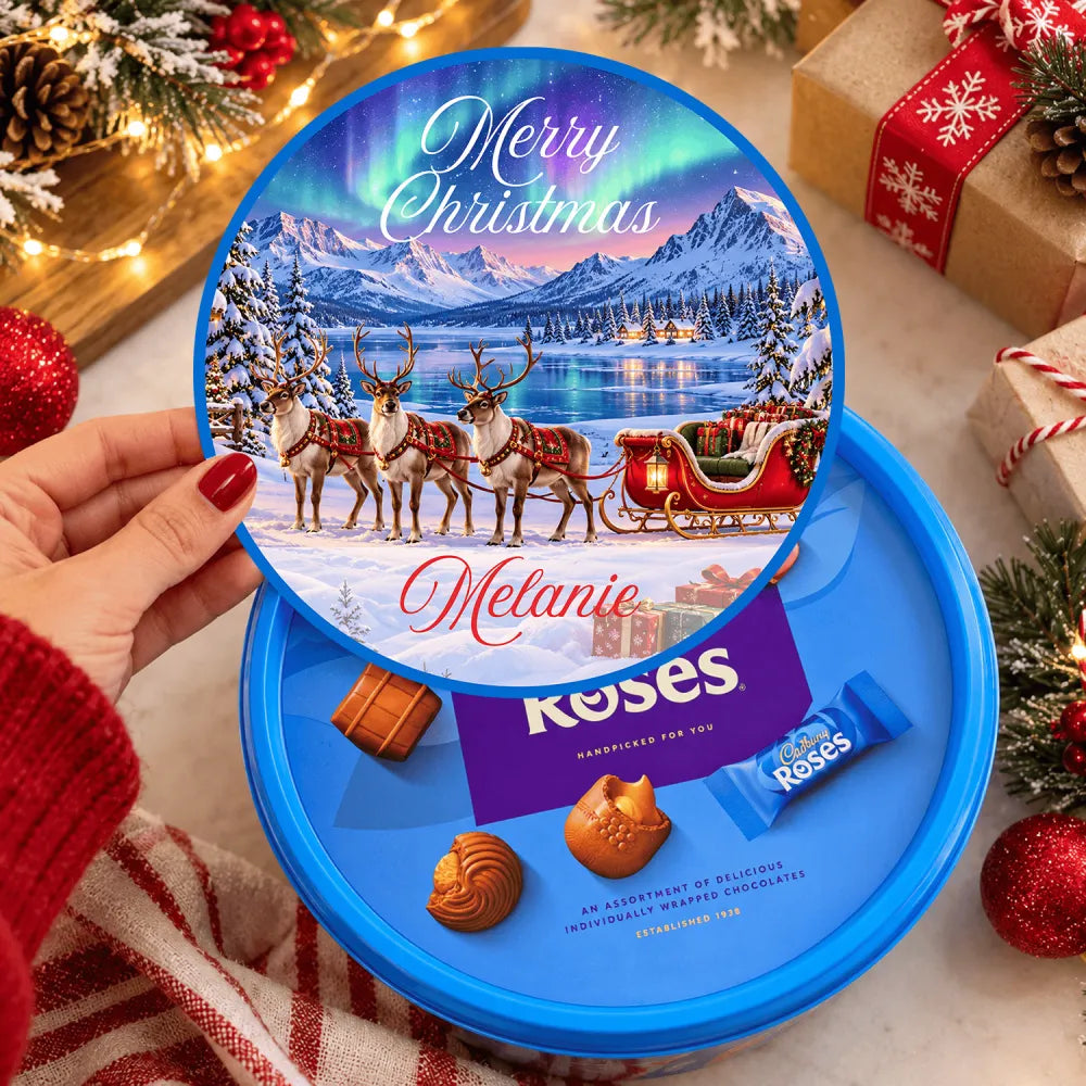 Blue circular tin of cadbury roses with lapland reindeer sleigh tub sticker personalized melanie winter scene