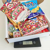 Christmas-themed chocolate bar with an owl and teddy bear design in colorful paper from late late toy sweet box