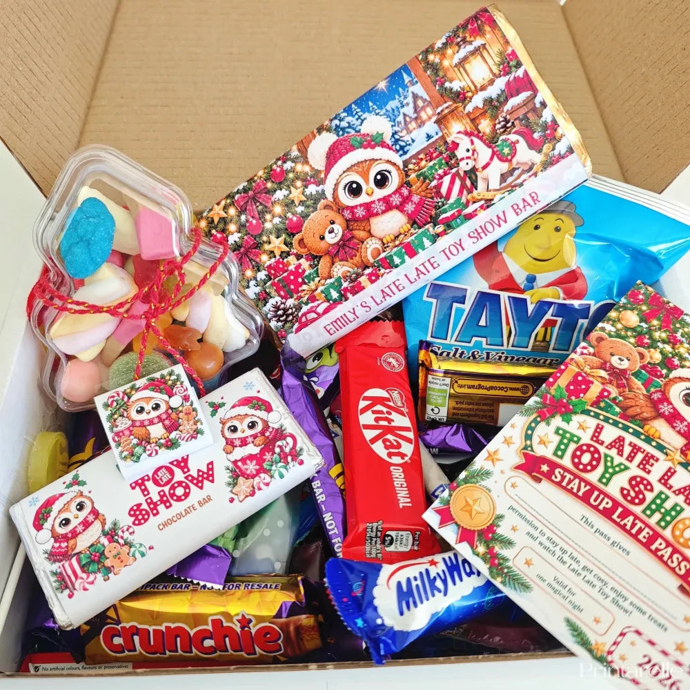 Christmas-themed chocolate bar with festive owl in santa hat wrapped in colorful late late toy sweet box packaging