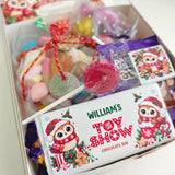 A festive white chocolate bar with a cartoon owl in santa hat from the late late toy show sweet box