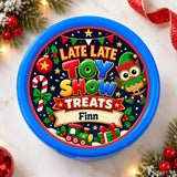 Blue plastic container with festive late late toy themed sticker showing cartoon owls candy canes and trains
