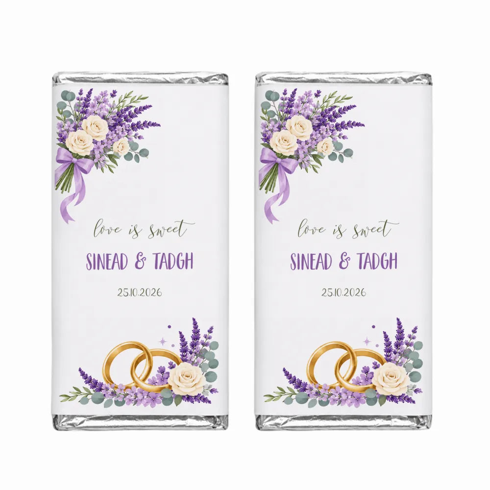 Two personalised 40g chocolate bars with purple lavender floral labels and gold rings for sinead and tadhg wedding