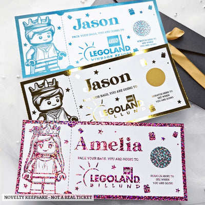 Three colorful glittery personalised legoland foil scratch off tickets with minifigure designs and kraft envelope keepsake