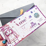 Colorful gift card with robot illustration and text on a white surface