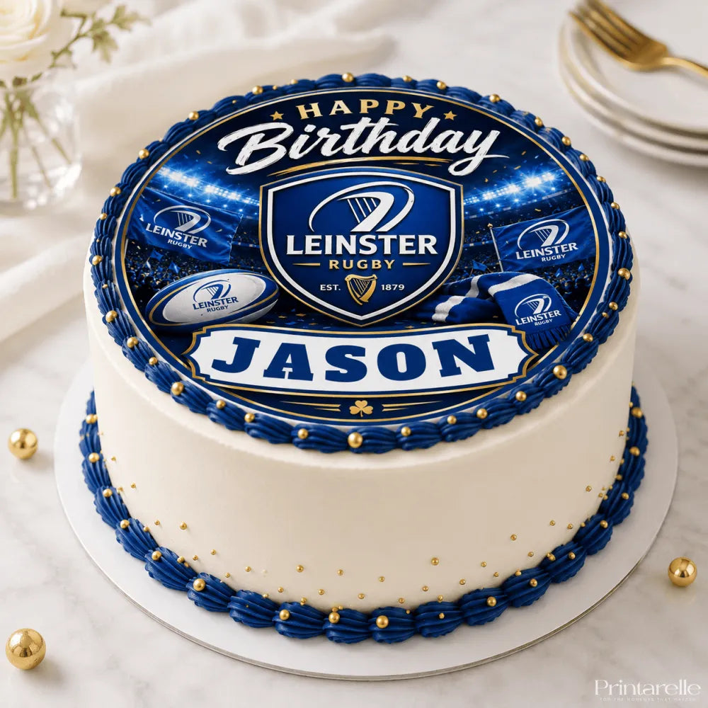 A round leinster rugby birthday cake with white frosting blue and gold piping and an edible icing sheet cake topper