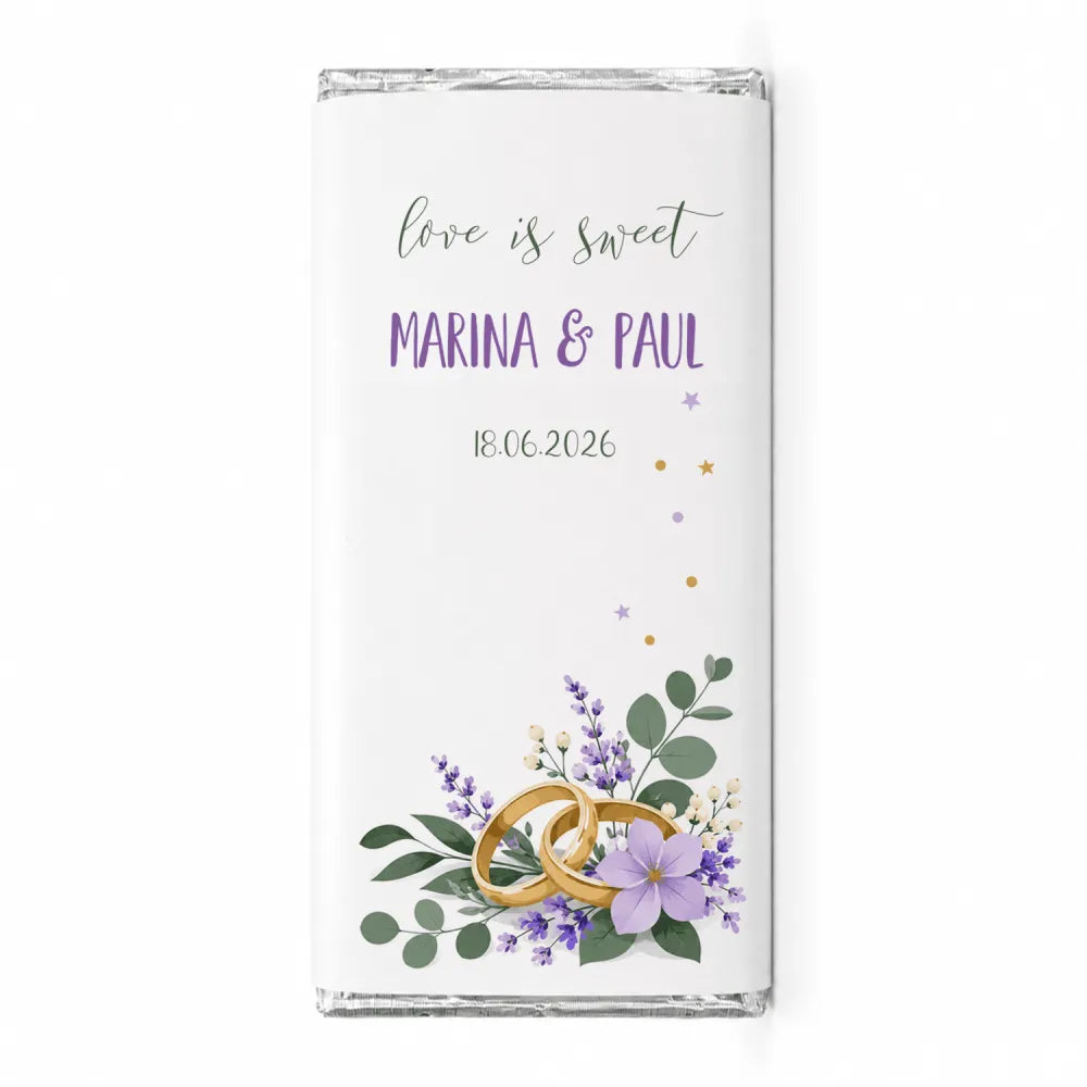 A white chocolate bar with a personalised 40g design featuring gold wedding rings lavender flowers and greenery