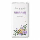 A white chocolate bar with a personalised 40g design featuring gold wedding rings lavender flowers and greenery