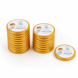 Golden chocolate coins with white labels featuring an angel boy illustration for christening chocolate coins gift