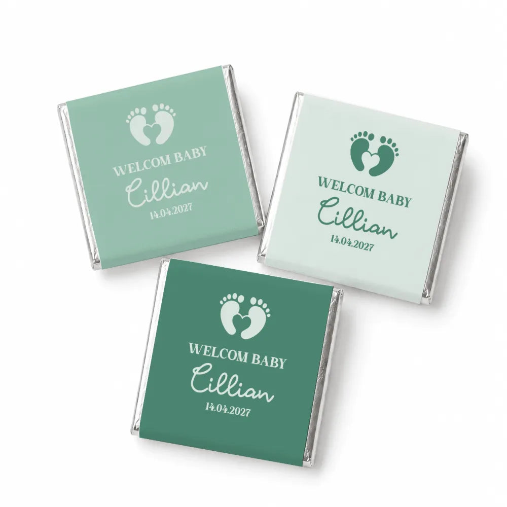 Three mint green and teal foil-wrapped mini neapolitan chocolates with welcome baby footprints design perfect baby favours