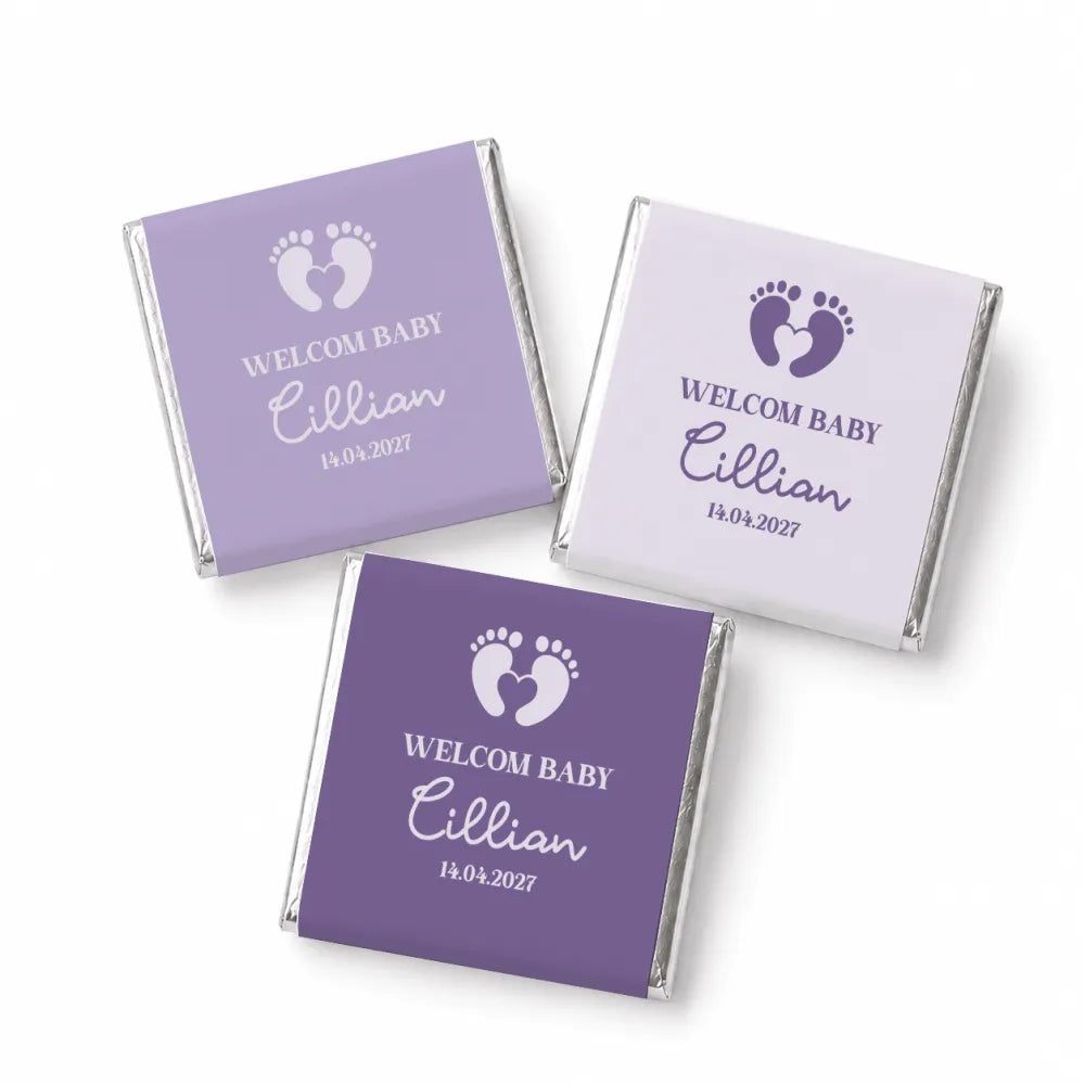 Personalized purple and white mini neapolitan chocolates wrapped in silver foil with baby footprint design for baby favours