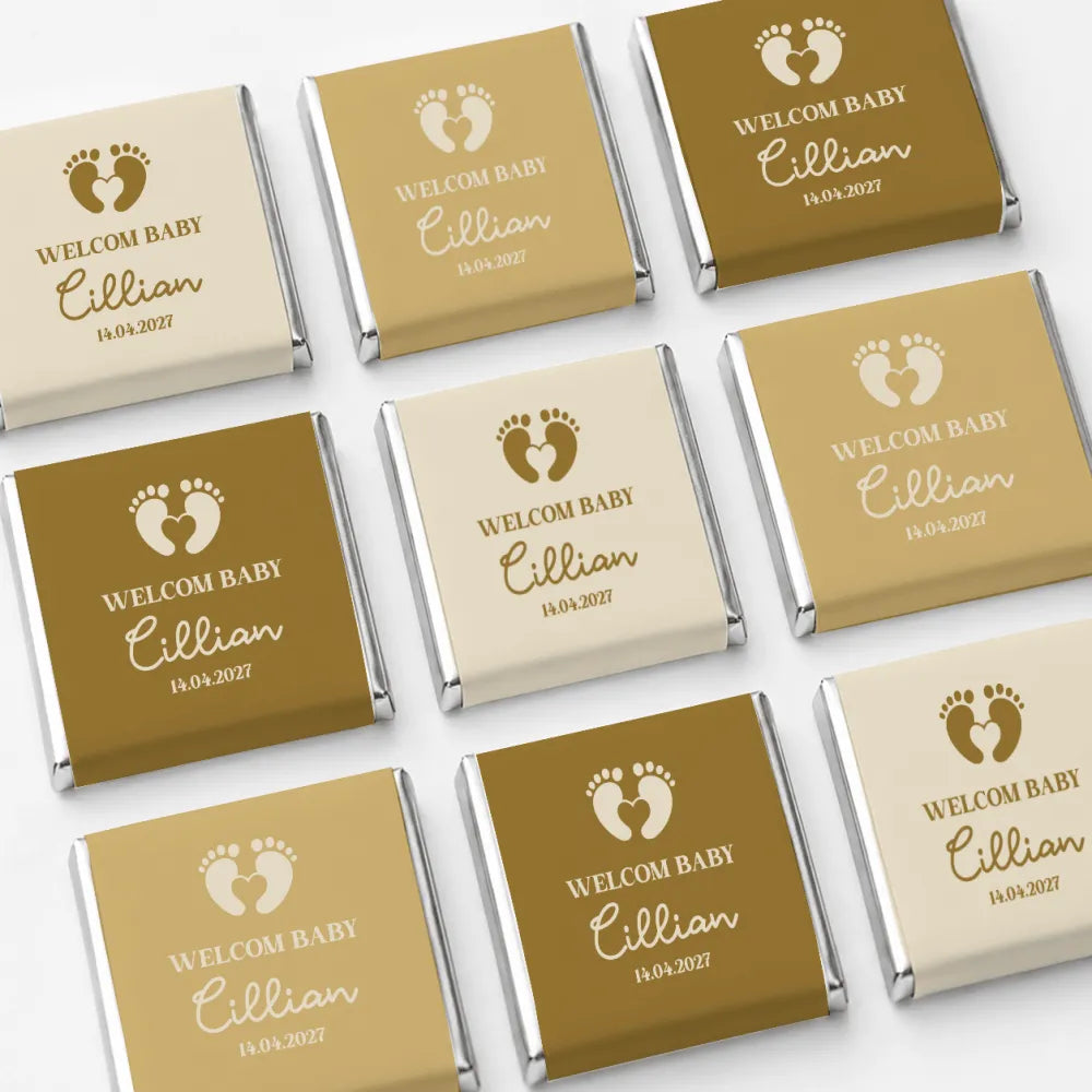Personalized gold and cream foil wrapped mini neapolitan chocolates with welcome baby cillian message for baby favours