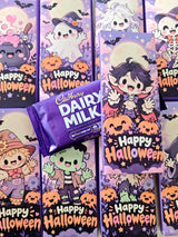 Purple wrapped cadbury dairy milk halloween chocolate wrap with cartoon little ghouls and happy halloween text