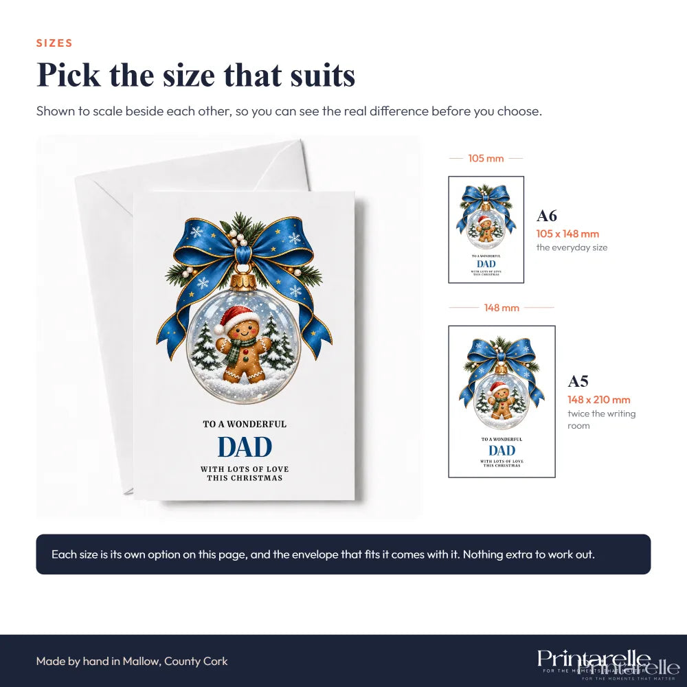 White dad christmas card featuring a gingerbread dad inside a glass bauble with blue ribbon and pine sprigs on matte paper