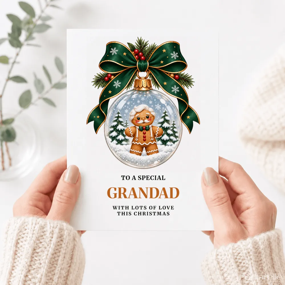 A festive white grandad christmas card with a glass gingerbread bauble wearing round glasses and a green bow tie