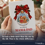 A festive white dad christmas card featuring a gingerbread couple inside a glass ornament with a red ribbon bow