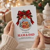 A festive white christmas card with red ribbon bow and gingerbread couple snow globe addressed to mam and dad dad christmas card