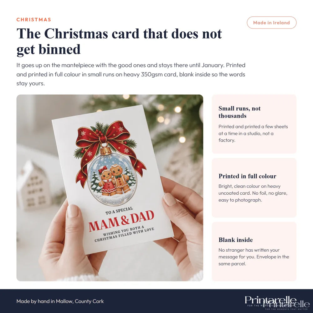 White christmas card featuring a gingerbread couple inside a snow globe with red bow on heavy 350gsm cardstock perfect dad christmas card