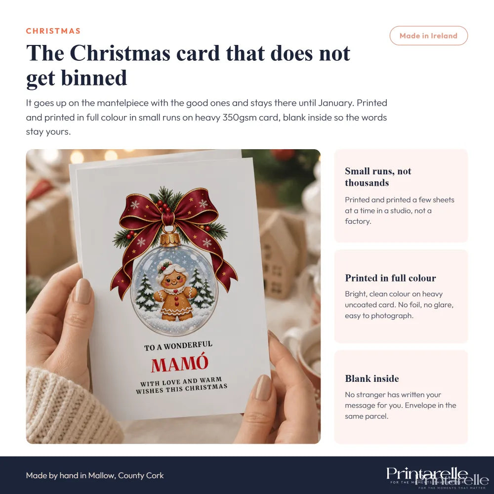 White mamó christmas card featuring a gingerbread man snow globe with red ribbon on heavy 350gsm paper