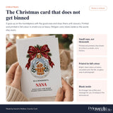 A festive nana christmas card featuring a gingerbread man snow globe with red ribbon and greenery heart brooch design
