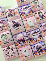 Pink and purple mini neapolitan chocolates with halloween ghosts witches and zombies in little monsters wrappers