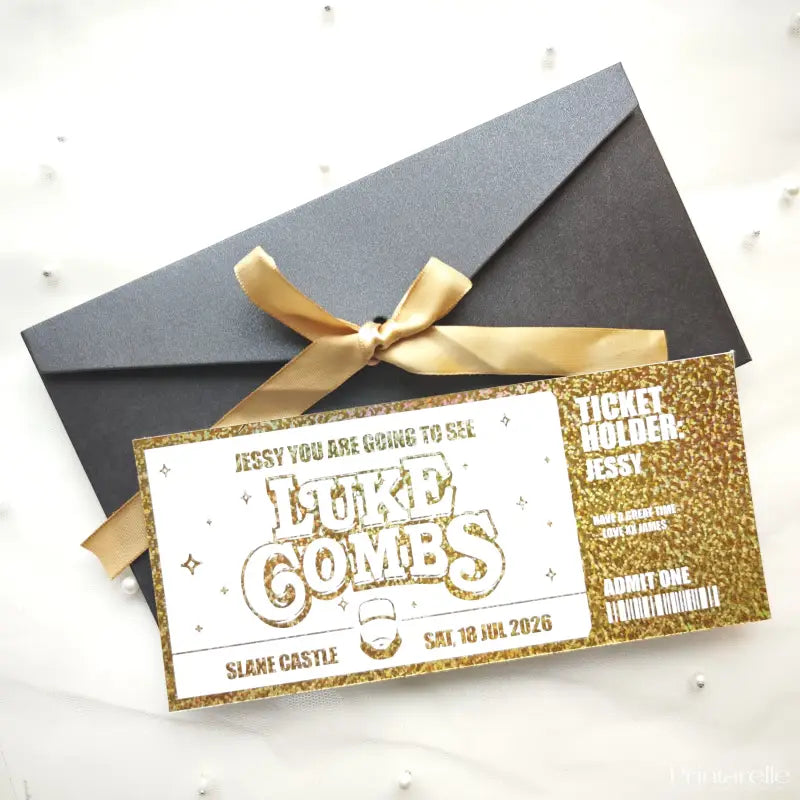 Gold ticket-style invitation with a black envelope and gold ribbon on a white background