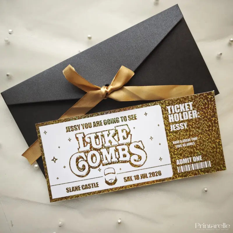 Invitation card with gold ribbon and black envelope on a light gray background