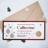 Greeting card with Christmas ornaments and envelope on a snowy background