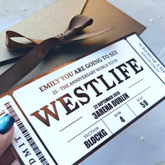 Ticket-like design with text and a brown ribbon on a light background