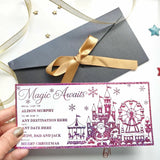 A festive pink glitter reveal card featuring a whimsical winter theme park with santa castles and a ferris wheel