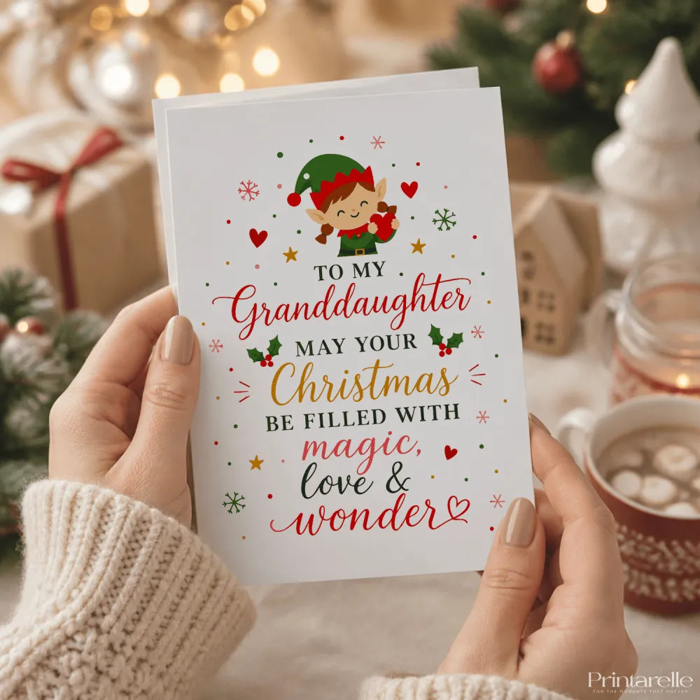 White christmas card with a green elf and festive design saying to my granddaughter may your christmas be filled with magic love wonder