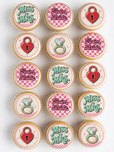 Pink and white checkered cupcakes with miss to mrs and team bride cupcake toppers on icing sheet and wafer paper