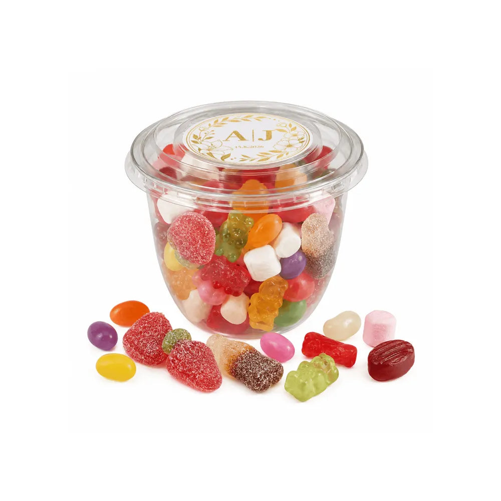 Clear plastic tub filled with colorful assorted gummy candies for monogram wreath foiled sticker wedding use