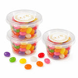 Clear plastic mini tub filled with colorful jelly beans sealed with white lid and gold monogram wreath foil sticker